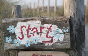 image of a wooden sign that says start