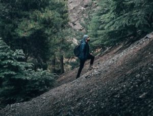 man climbing a mountain