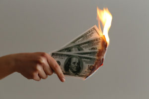 image of burning money